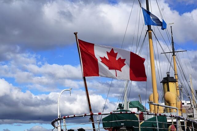 a picture of a boat with a canadian flag in halifax for the website design halifax page
