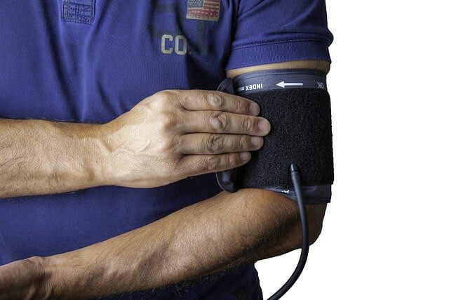 a person checking blood pressure for the Medical Website Design Company page