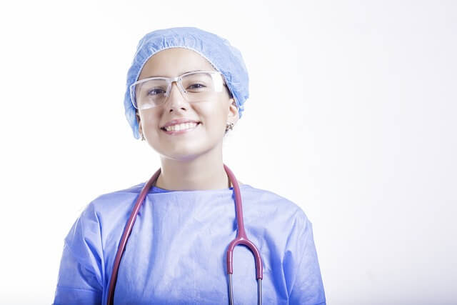 A picture of a woman smiling who is a doctor or a medical professional for the Medical Website Design Company page