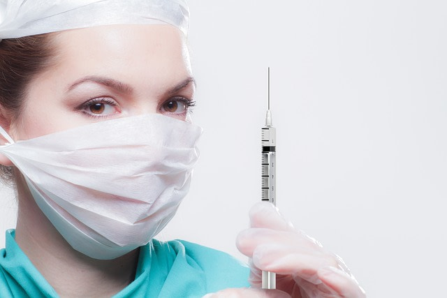 plastic surgeon with needle for the web design for plastic surgeon page